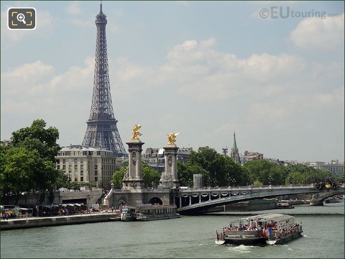 Tourists viewing Eiffel Tower from Bateaux Parisiens