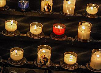 Burning candles inside Eglise Saint-Pierre de Montmartre