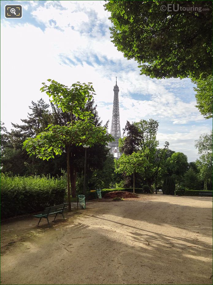 View SE from Jardins du Trocadero to Eiffel Tower between garden trees