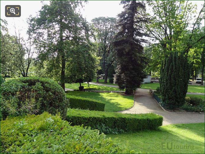 Various trees, hedges and winding paths in Jardins du Trocadero looking South