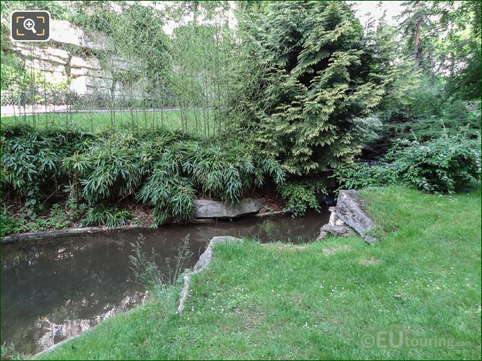 Stream and evergreen trees in Jardins du Trocadero looking NW