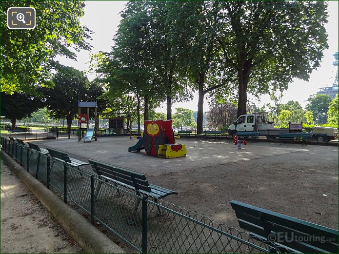 Fence around childrens playground with park benches at Jardins du Trocadero