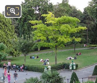 Tourists within Jardins du Trocadero open grass aArea