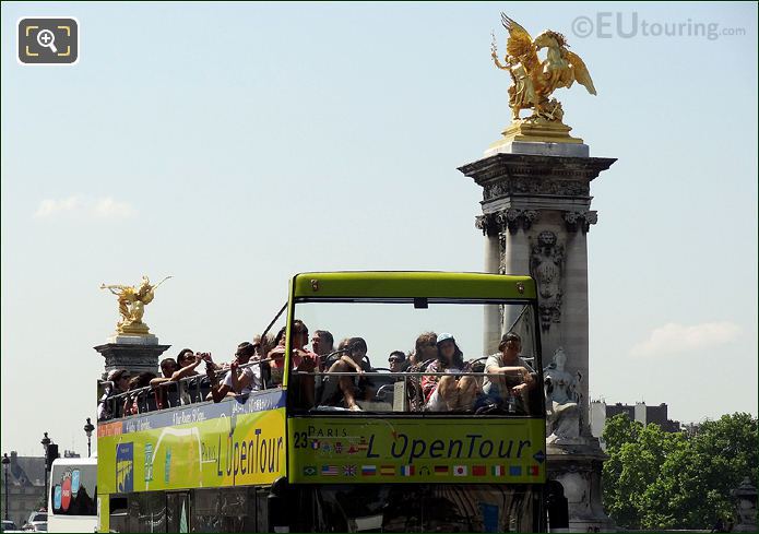 OpenTour bus crossing Pont Alexandre III in Paris