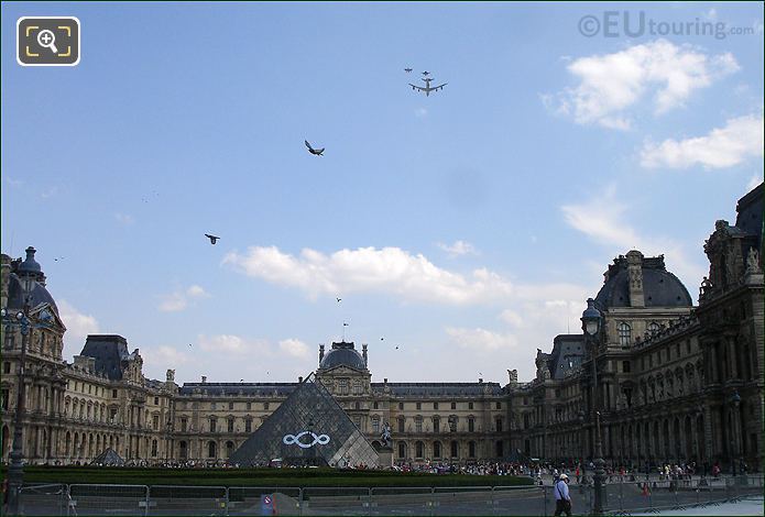 Jet plane escort over Louvre pyramid