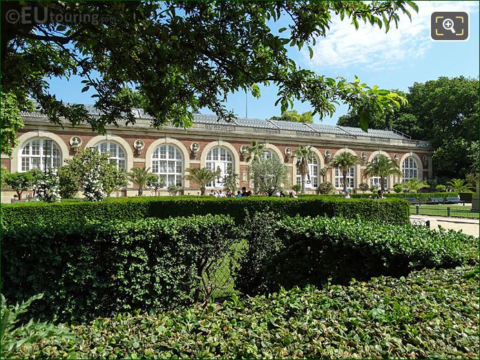View to front of Orangerie from hedges and trees
