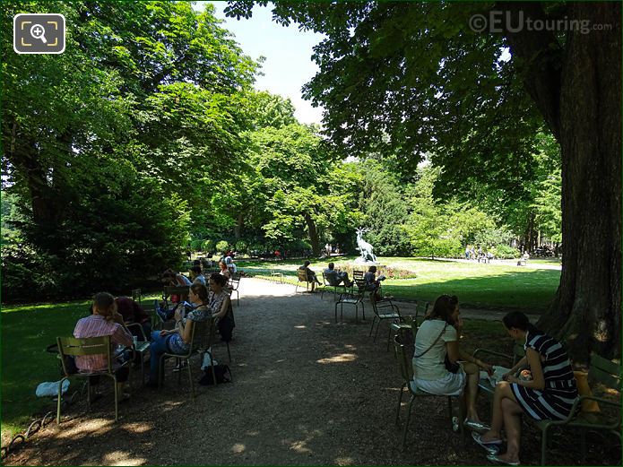 Tourists relaxing on green chairs in Jardin du Luxembourg