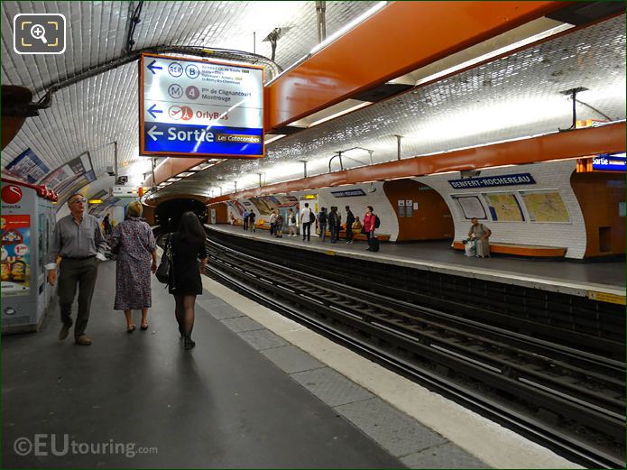 Denfert-Rochereau Metro stop with platforms and signs
