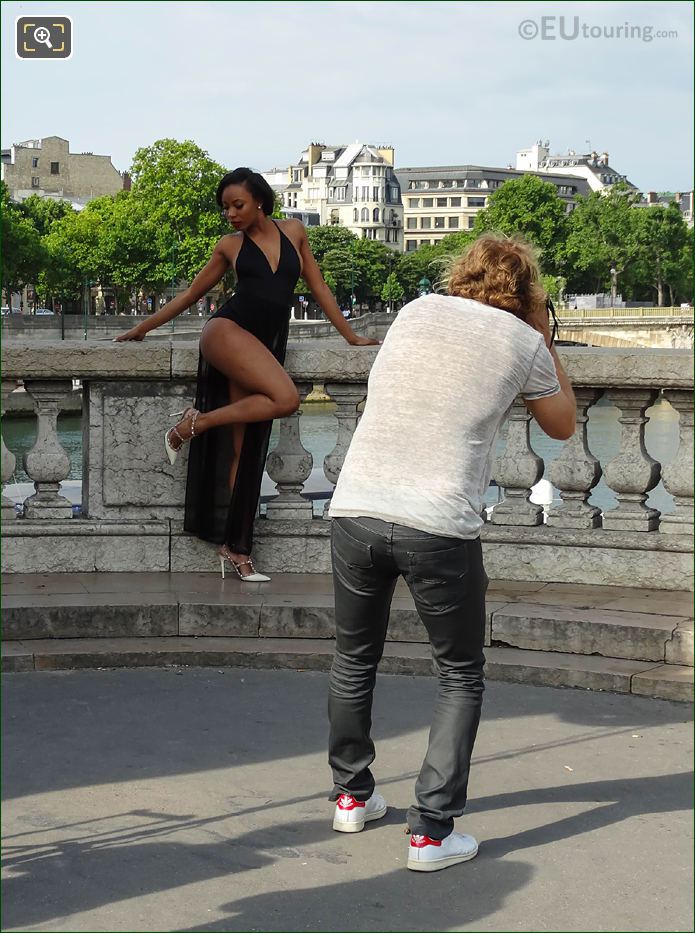 Photographer taking picture of glamour model in Paris