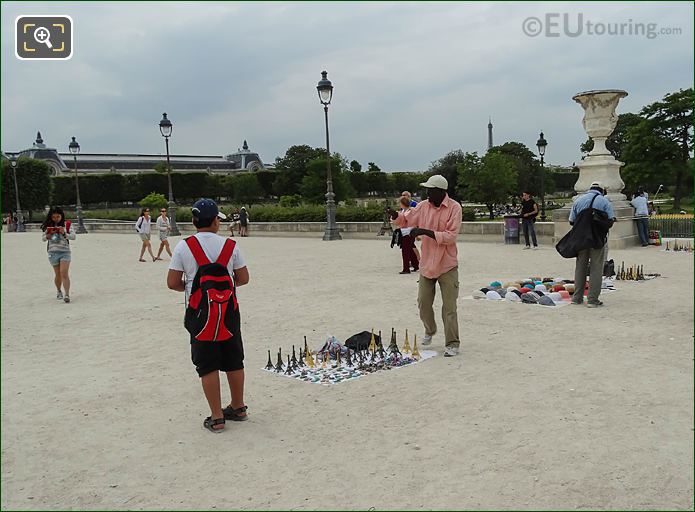 Street Sellers with miniature Eiffel Tower's at The Louvre