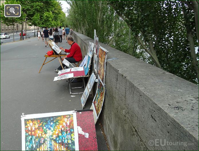 Artist painting in Paris at Quai Francois Mitterrand