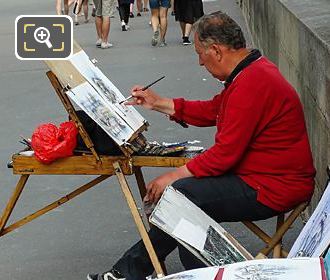 Artist painting along Quai Francois Mitterrand