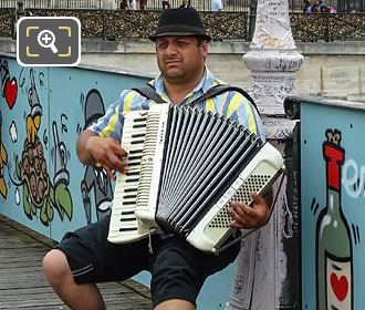 Accordian musician busking on Pont des Arts
