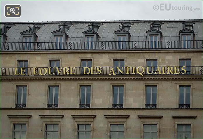 Louvre des Antiquaires building name on West facade