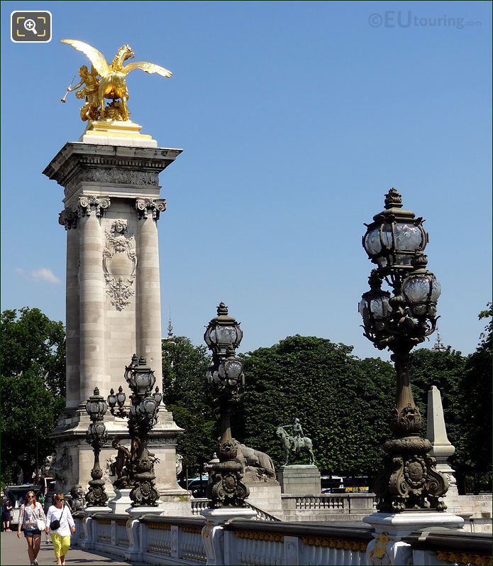 Gold statue and black lamp posts on Pont Alexandre III