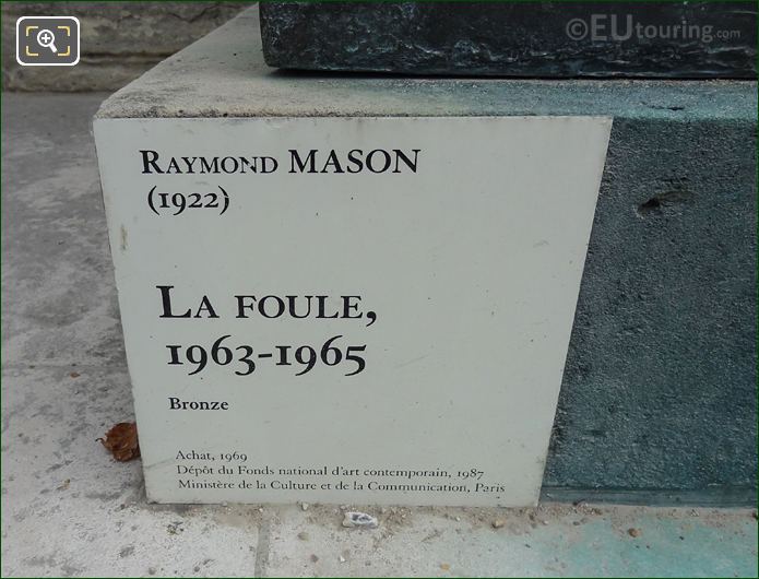 Information plaque on La Foule sculpture