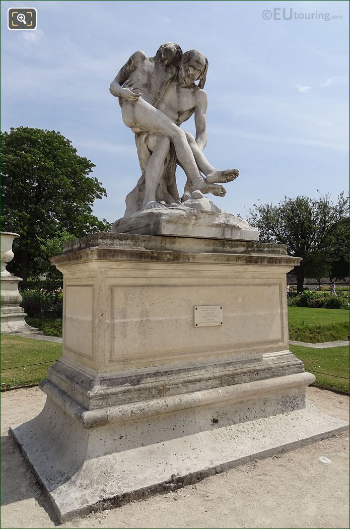 Le Bon Samaritain statue on stone pedestal