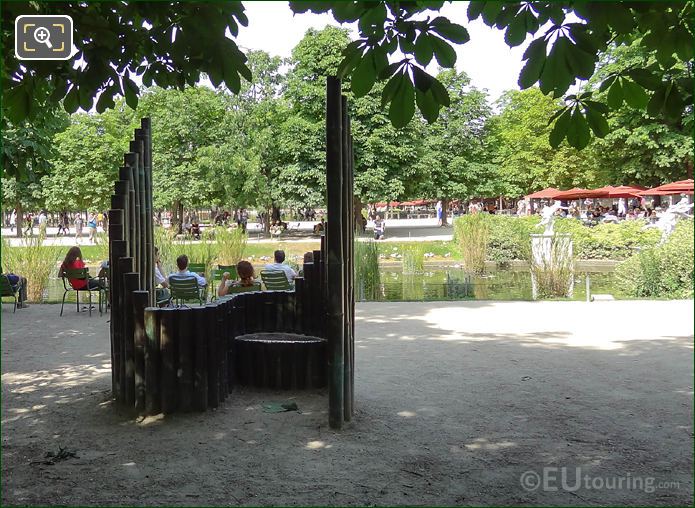 Confidence sculpture next to pond inside Jardin des Tuileries