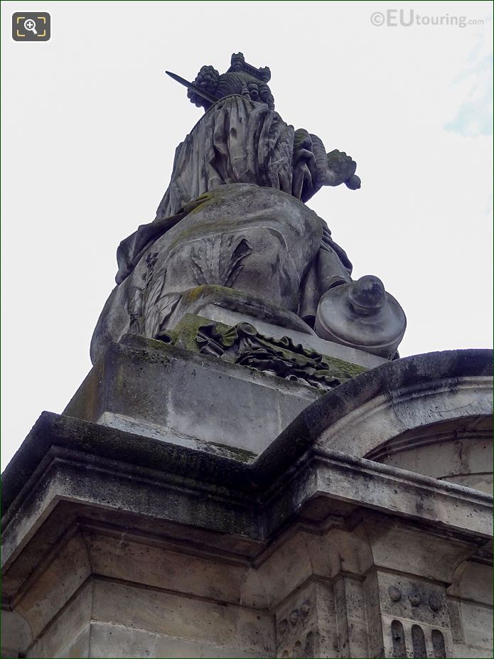 View upwards of back and right side of Lille statue
