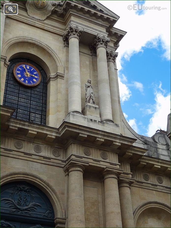 South facade of Eglise Saint-Roch with Sainte Genevieve statue