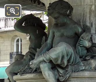 Children statues on Nymphe Fluviale fountain in Paris