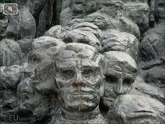 Bronze faces on La Foule sculpture