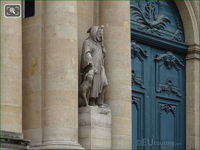 Saint Roch statue next to front doors of Eglise Saint-Roch