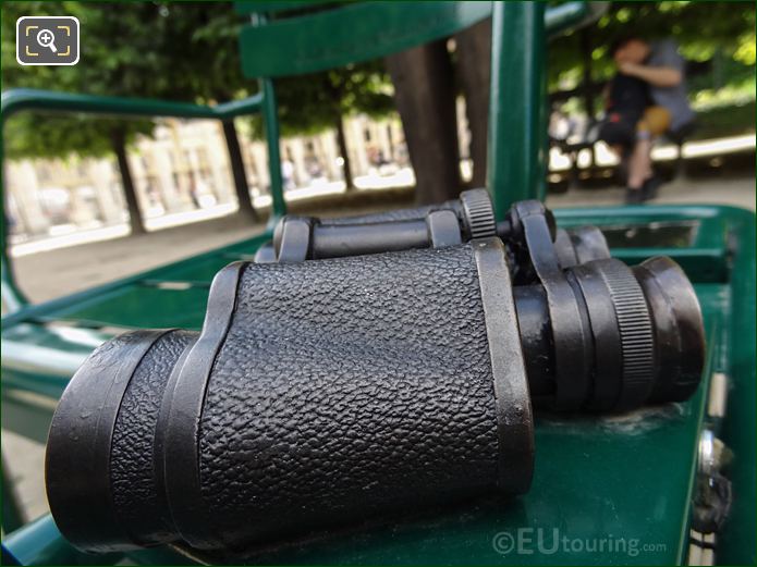 Side view of bronze binoculars fixed to Les Confidents sculpture