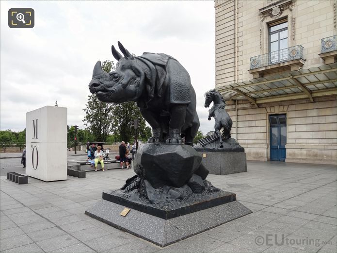 Front view of Rhinoceros statue with another animal sculpture