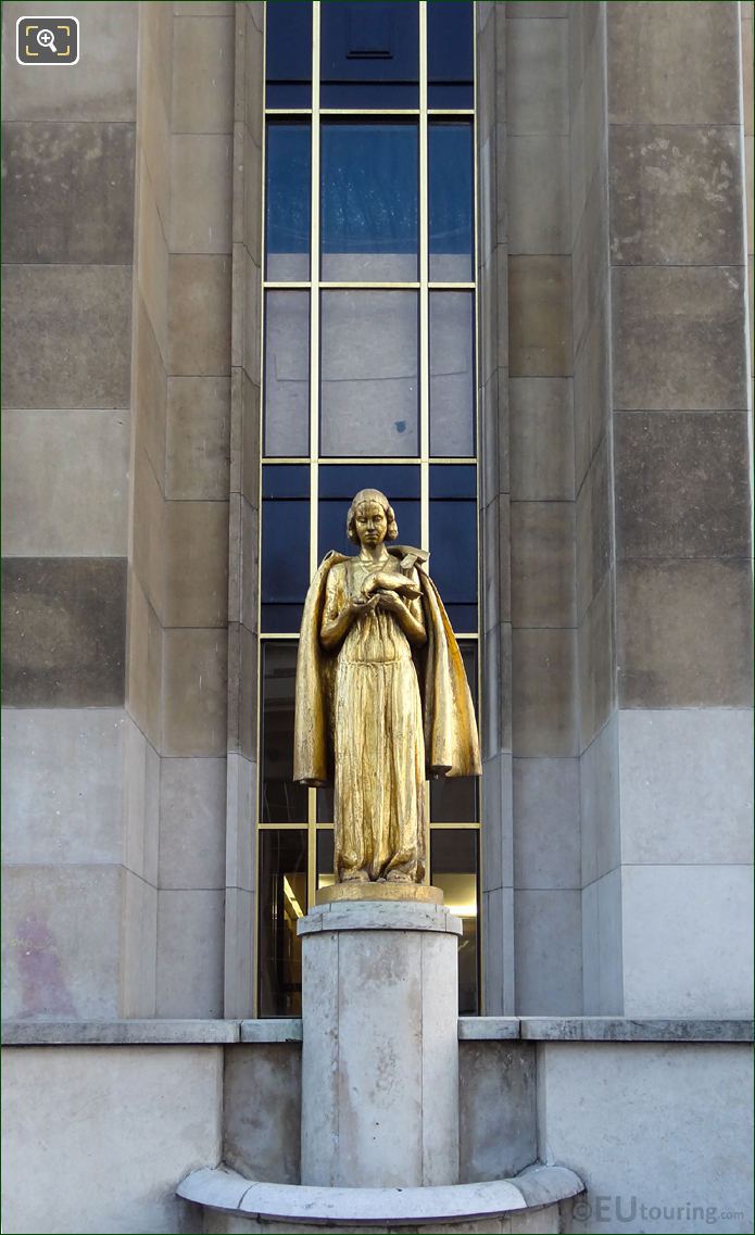 Golden female figure holding bird at Palais de Chaillot
