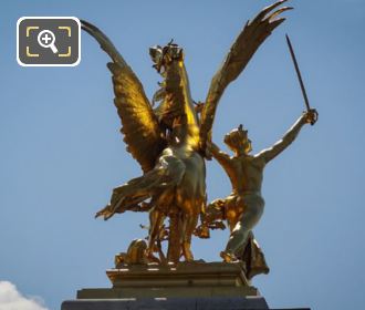 SE golden statue on Alexandre III bridge in Paris