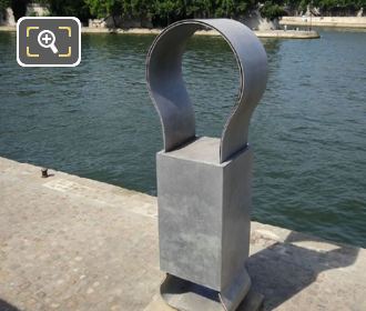 Paris steel sculpture and River Seine