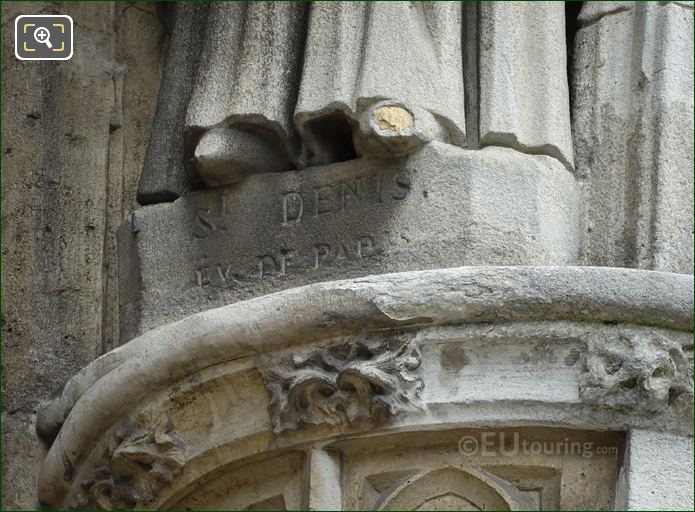 St Denis Ev de Paris inscribed on stone statue base
