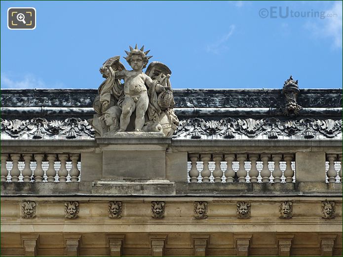 West facade Aile Henri II, and statue by roof