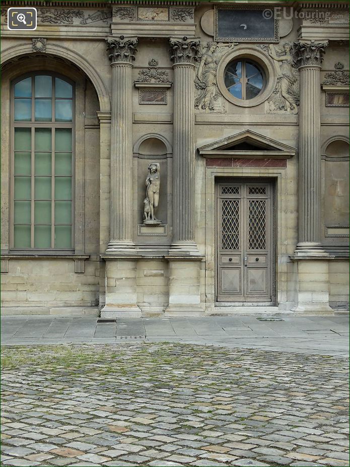 Aile Est W facade and Bacchante statueat The Louvre