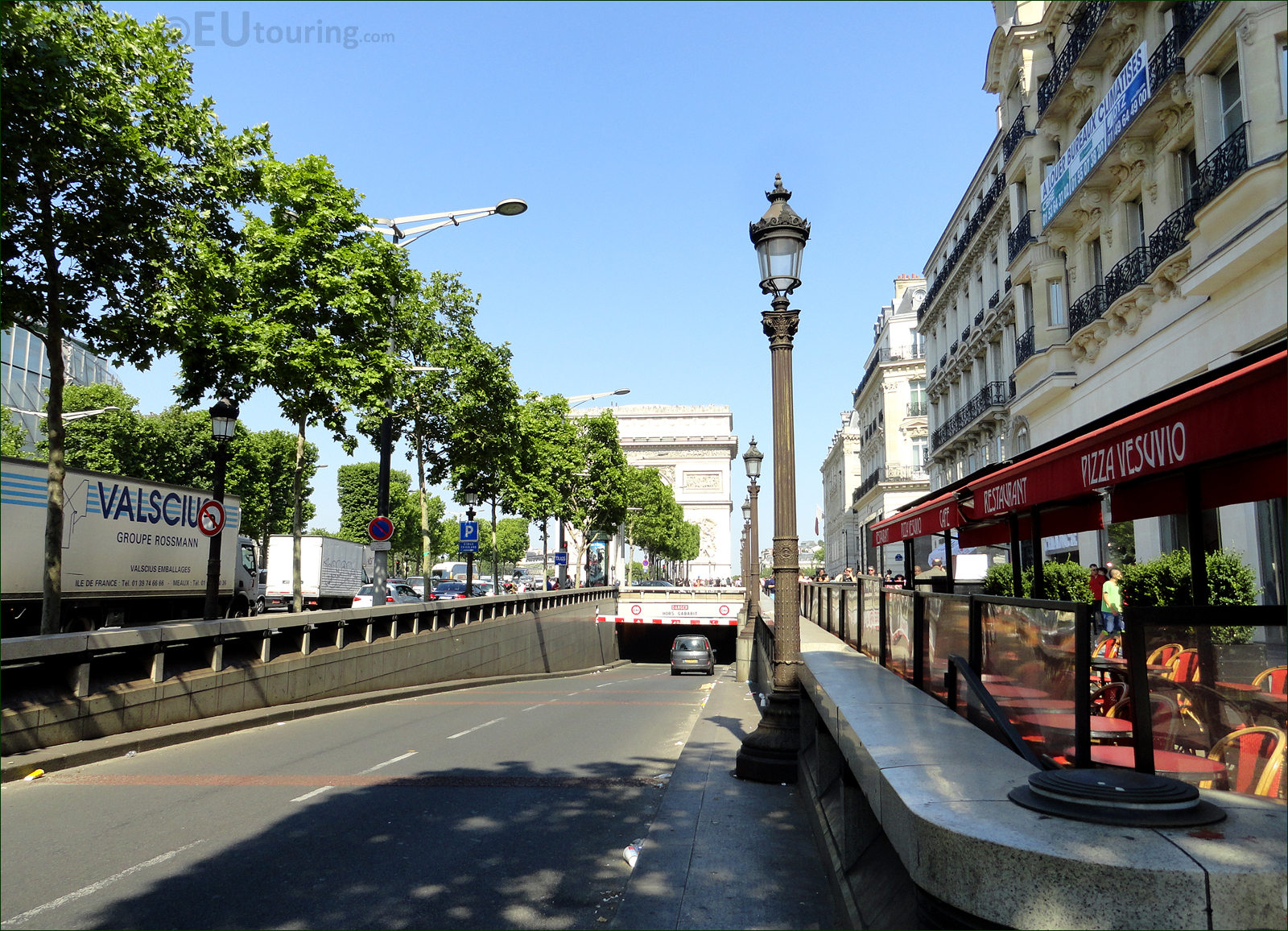 Street view of Champs-Elysees Avenue with building LOUIS VUITTON