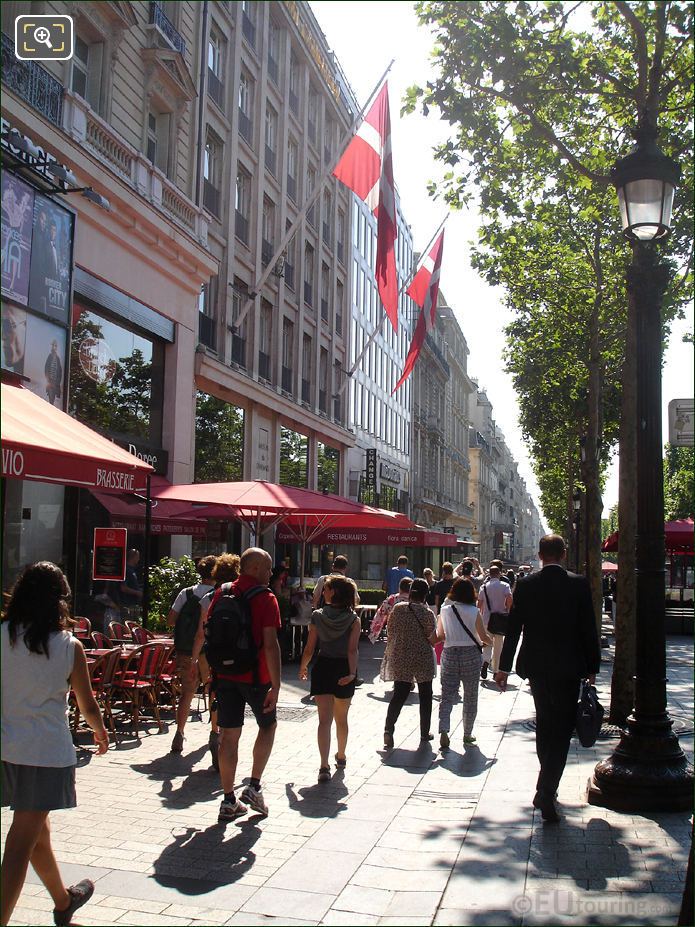Tourists walking along Avenue des Champs Elysees
