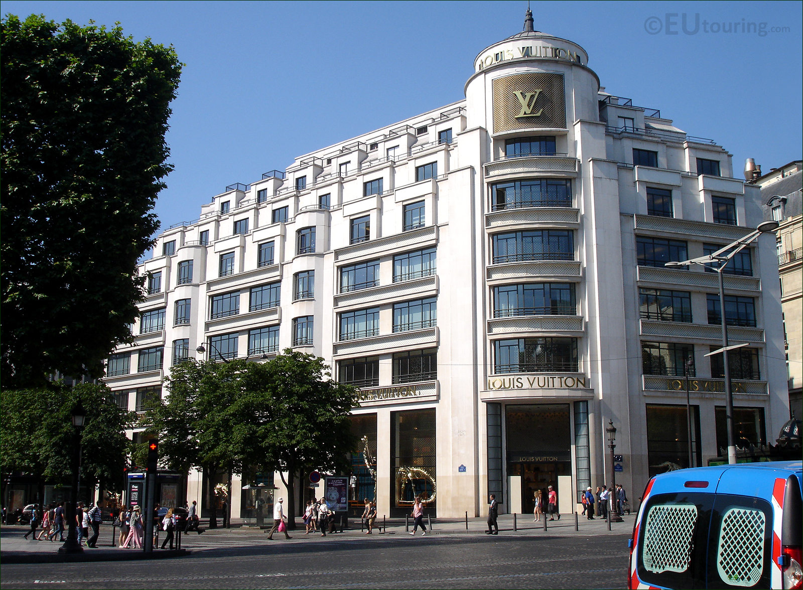 Street view of Champs-Elysees Avenue with building LOUIS VUITTON