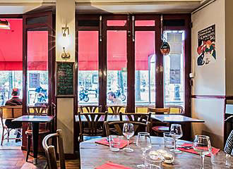 Tables inside Le Bastringue Brasserie