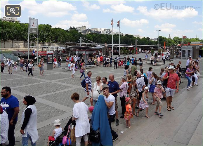 Tourists at quay for River Seine cruises