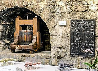 Antique wine press at Musee du Vin