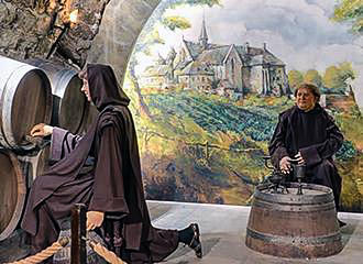 Monks making wine within Musee du Vin