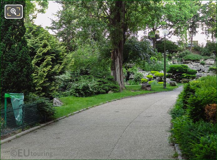 Public pathway with trees and shrubs in Jardins du Trocadero looking NW