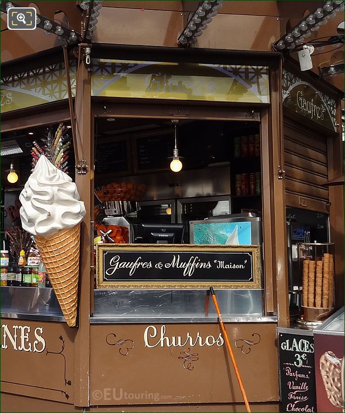 Kiosk food stand selling churros, waffles and muffins in Jardins du Trocadero