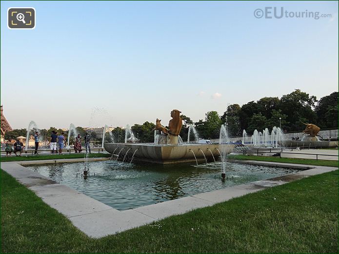 Water fountain with horses and dog statues