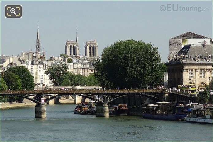 OpenTour tour bus passing Pont des Arts in Paris