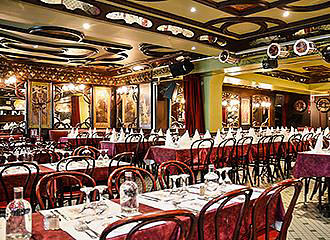 Tables inside La Cremaillere 1900 Restaurant