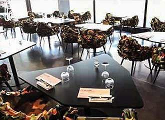 Tables and chairs inside Le Balcon restaurant