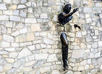 Le Passe-Muraille Sculpture on wall