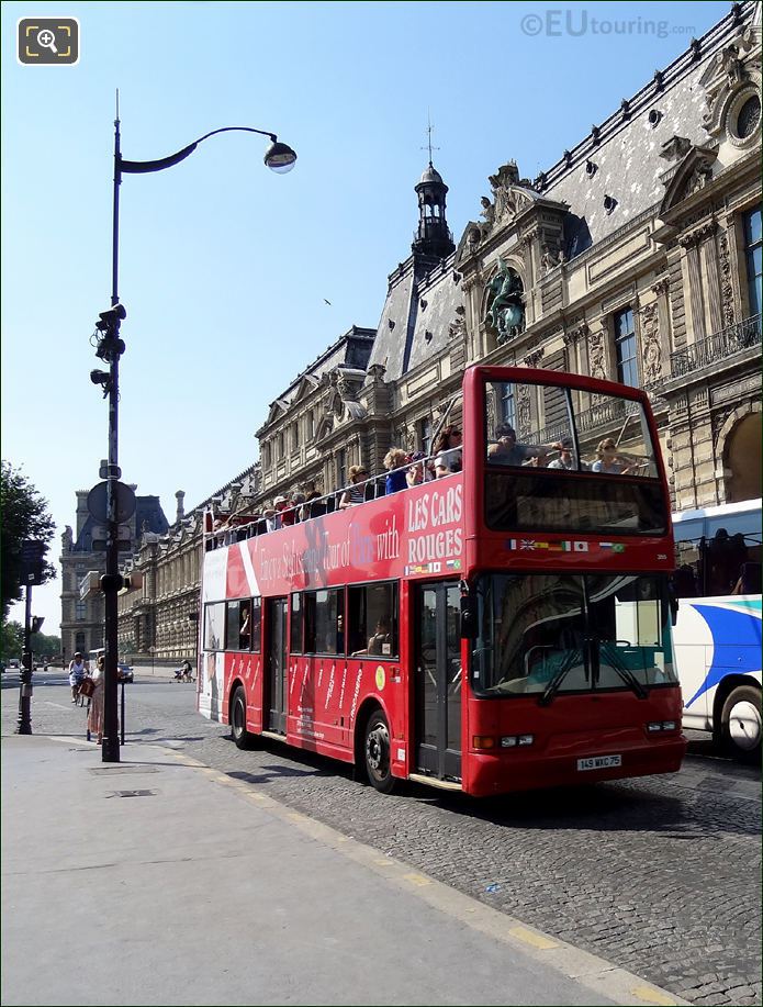 Les Car Rouges passing Louvre Museum